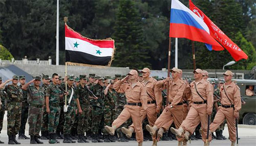desfile de fuerzas rusas y sirias en la base de Hmaymim Putin llega a Siria y ordena el comienzo de la retirada de tropas rusas